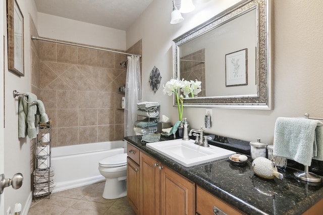 full bathroom featuring tile patterned flooring, vanity, toilet, and shower / tub combo