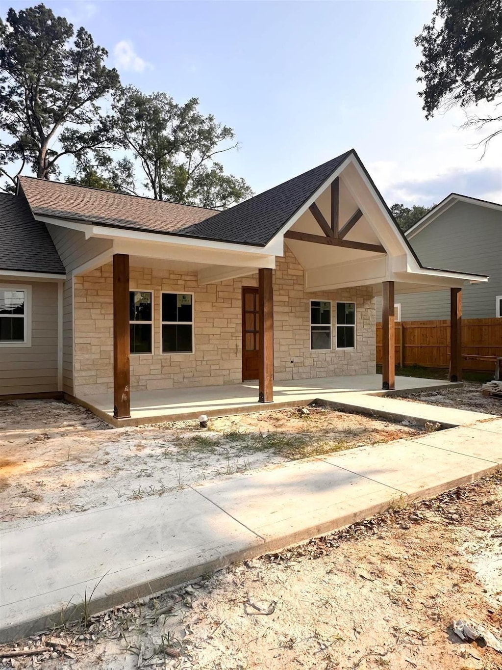 235 Durdin Dr, Silsbee, TX 77656 - view of front of property with stone siding and a shingled roof