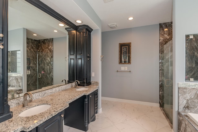 bathroom featuring marble finish floor, visible vents, a sink, and a marble finish shower