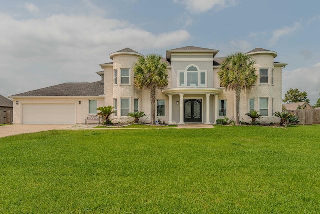 mediterranean / spanish-style house with driveway, a garage, fence, a front lawn, and brick siding