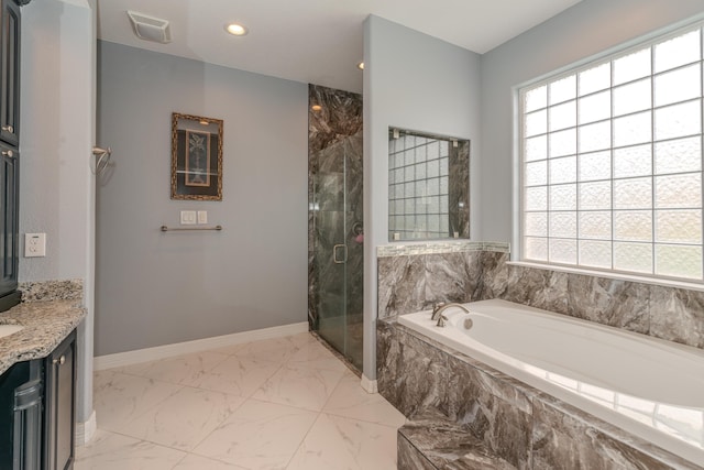 bathroom featuring marble finish floor, plenty of natural light, visible vents, and a shower stall