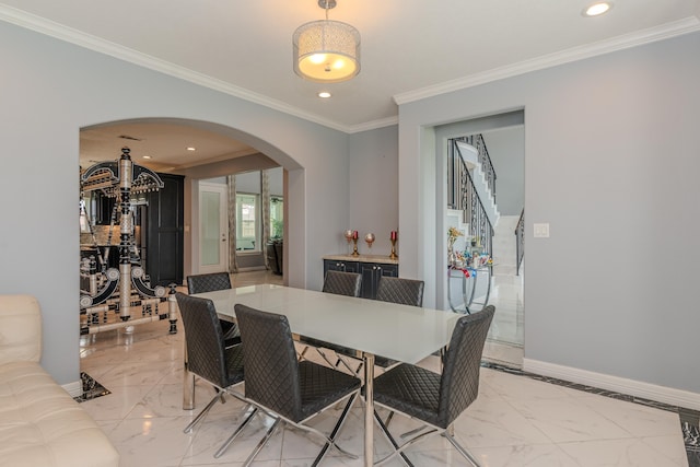 dining space with arched walkways, marble finish floor, baseboards, and recessed lighting