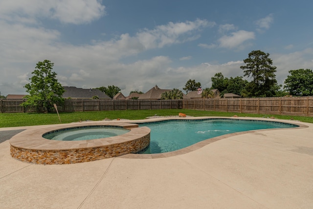 view of swimming pool featuring a yard, a patio area, a fenced backyard, and a pool with connected hot tub