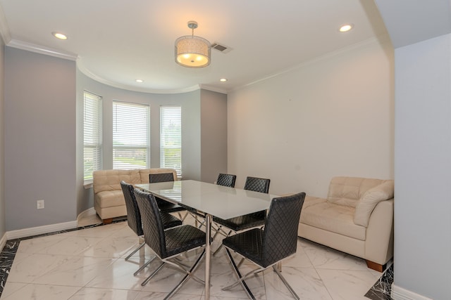 dining area featuring ornamental molding, recessed lighting, and baseboards