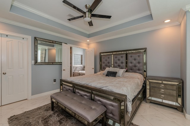 bedroom featuring crown molding, marble finish floor, a tray ceiling, and baseboards