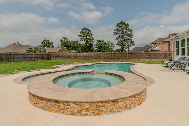 view of pool with a fenced backyard, a patio, a lawn, and an in ground hot tub