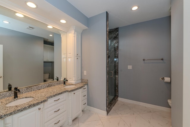 bathroom with marble finish floor, baseboards, a sink, and toilet