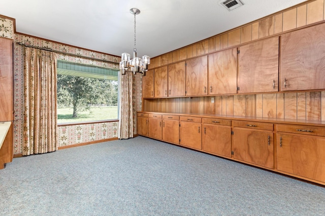 3030 Moore Rd, Beaumont, TX 77713 - unfurnished dining area with wallpapered walls, a chandelier, and carpet floors
