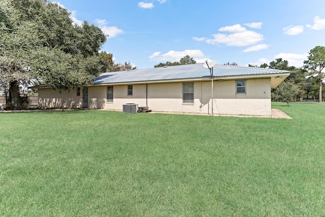 3030 Moore Rd, Beaumont, TX 77713 - back of house with brick siding and a lawn