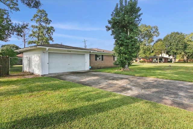 exterior space with a garage and a front lawn