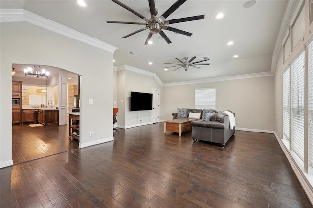 865 Leitrum St, Vidor, TX 77662 - living room with a ceiling fan, dark wood-type flooring, lofted ceiling, a chandelier, and recessed lighting