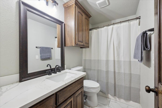 full bathroom with marble finish floor, toilet, vanity, and visible vents