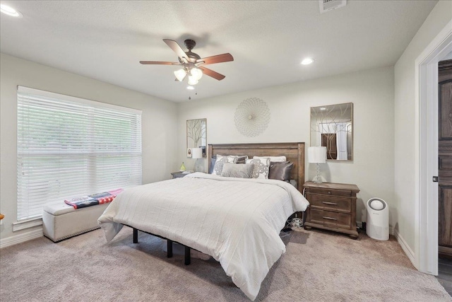 bedroom featuring recessed lighting, visible vents, carpet floors, baseboards, and ceiling fan