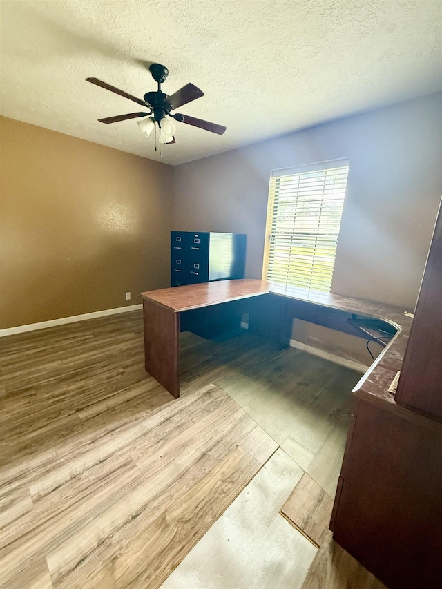 857 Sharp St, Bridge City, TX 77611 - unfurnished office with a ceiling fan, wood finished floors, and a textured ceiling