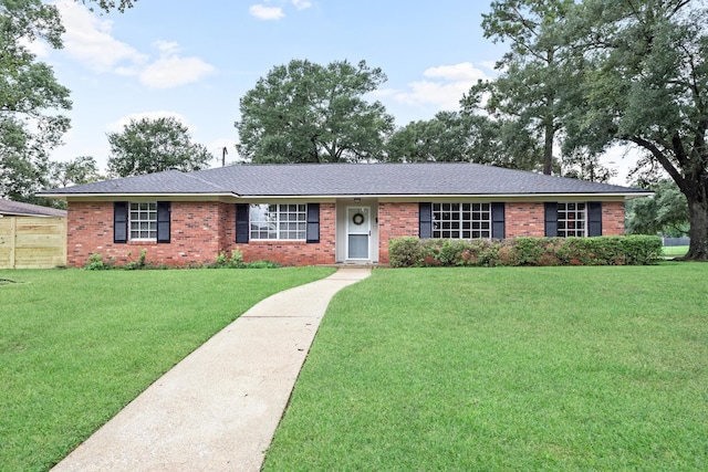 ranch-style home featuring a front yard