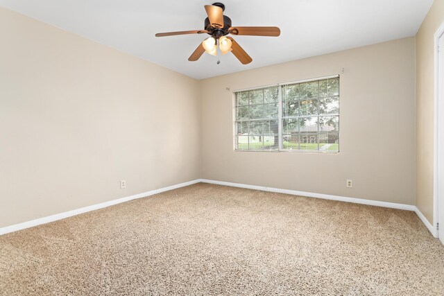 unfurnished room with ceiling fan and carpet floors