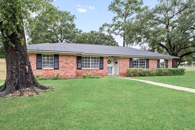 ranch-style house with a front lawn