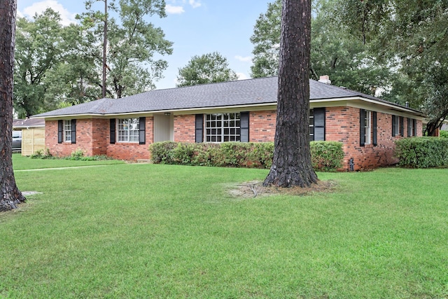 ranch-style home with a front lawn