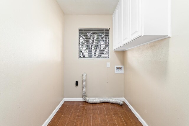 clothes washing area featuring cabinets and hookup for a washing machine