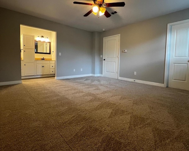 575 Hartman, Silsbee, TX 77656 - unfurnished bedroom featuring carpet flooring, connected bathroom, and a ceiling fan