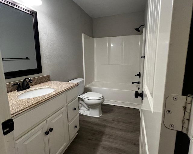 575 Hartman, Silsbee, TX 77656 - bathroom with vanity, wood finished floors, and bathing tub / shower combination