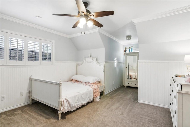 bedroom with carpet flooring, crown molding, ceiling fan, and lofted ceiling