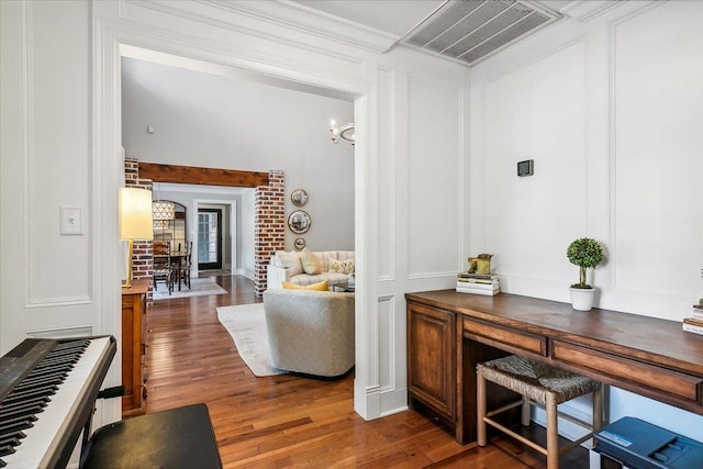 interior space with dark hardwood / wood-style floors and ornamental molding