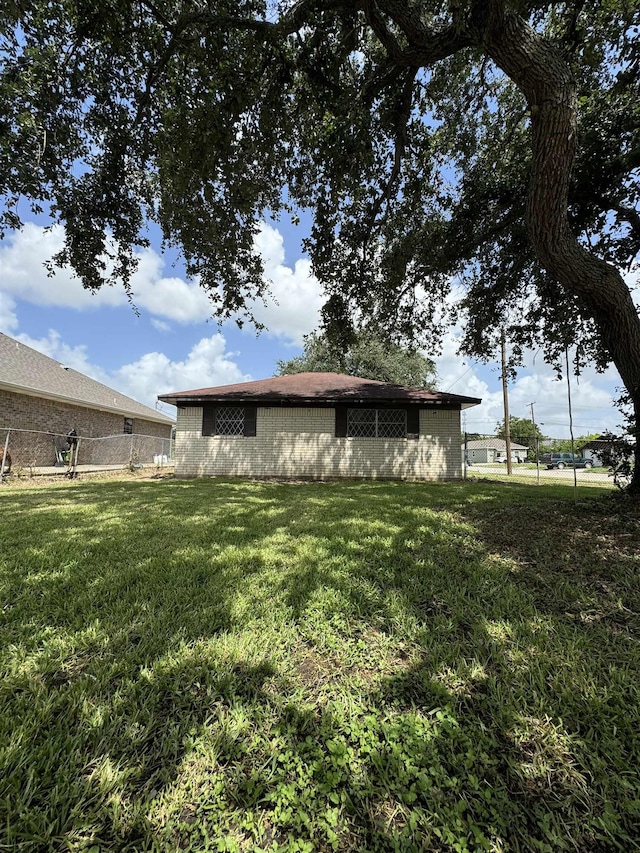 back of house with a yard