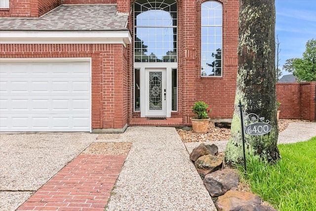 view of exterior entry featuring a garage