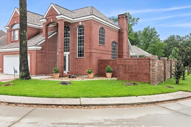 view of side of home featuring a lawn and a garage