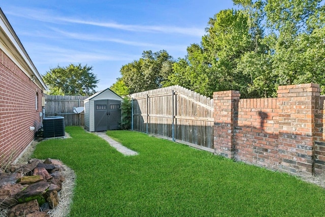 view of yard featuring cooling unit and a storage unit