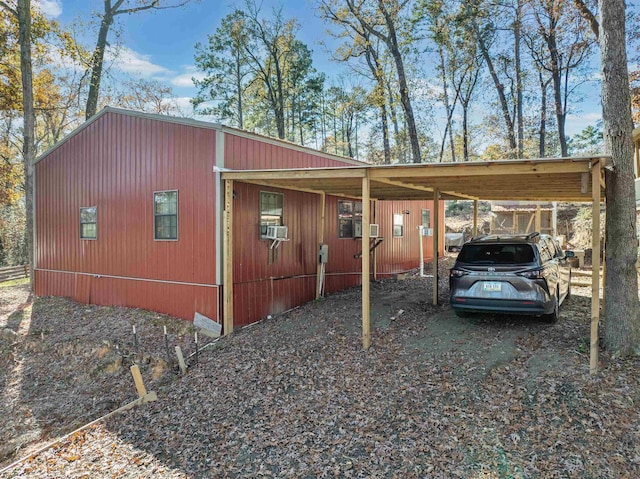 view of side of property with a carport