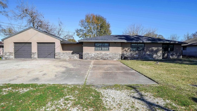 view of front of property with a front lawn and a garage