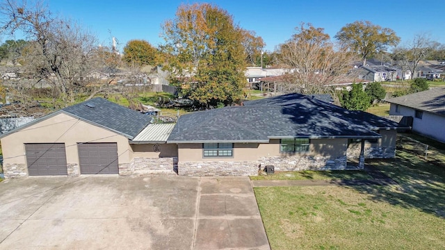 exterior space with a garage and a front yard