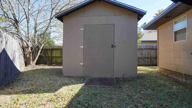 view of outbuilding featuring a yard