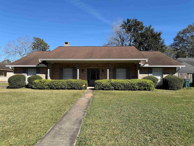 ranch-style home featuring a front yard