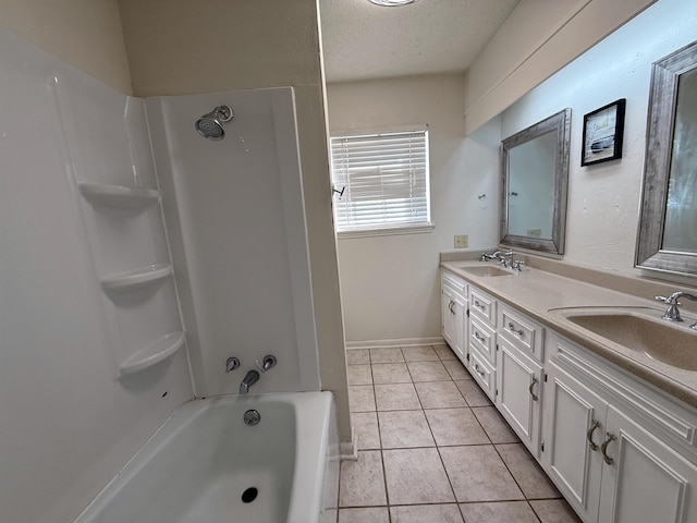 bathroom with tile patterned floors, vanity, a textured ceiling, and bathing tub / shower combination