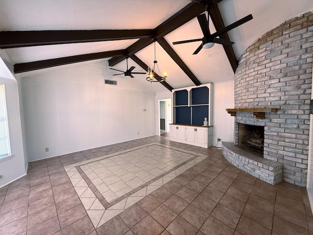 unfurnished living room with tile patterned floors, vaulted ceiling with beams, ceiling fan with notable chandelier, and a brick fireplace