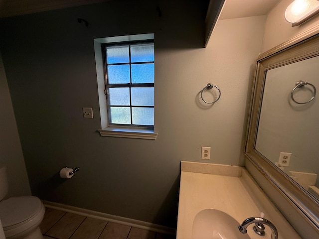 bathroom with toilet and sink