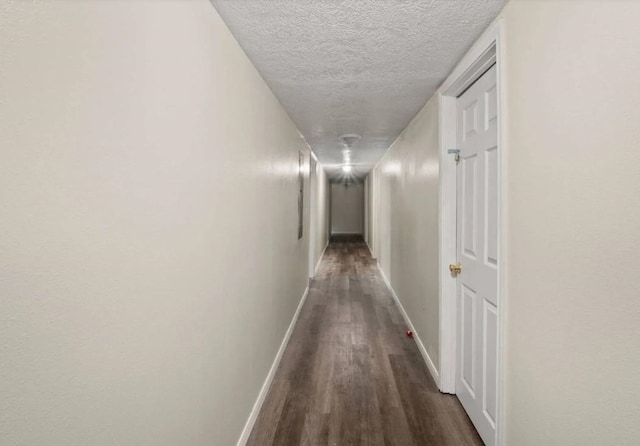 19995 S Fm 92, Fred, TX 77616 - hall with dark wood finished floors and a textured ceiling