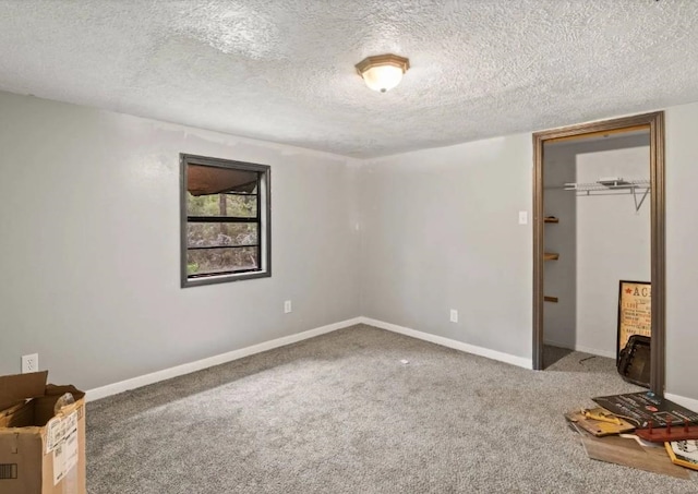 19995 S Fm 92, Fred, TX 77616 - unfurnished bedroom featuring carpet floors and a textured ceiling