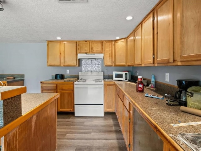 19995 S Fm 92, Fred, TX 77616 - kitchen with white appliances, under cabinet range hood, dark wood finished floors, a textured ceiling, and recessed lighting
