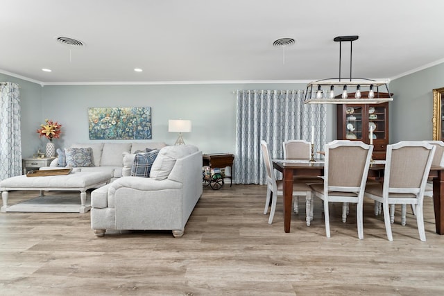 935 Nichols Dr, Beaumont, TX 77706 - living room featuring ornamental molding, wood finished floors, and recessed lighting