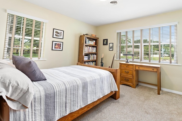 935 Nichols Dr, Beaumont, TX 77706 - bedroom featuring light colored carpet and baseboards