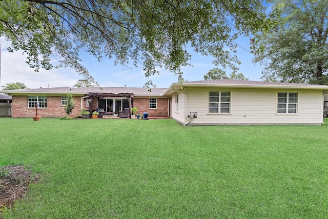 935 Nichols Dr, Beaumont, TX 77706 - back of house featuring a yard and brick siding