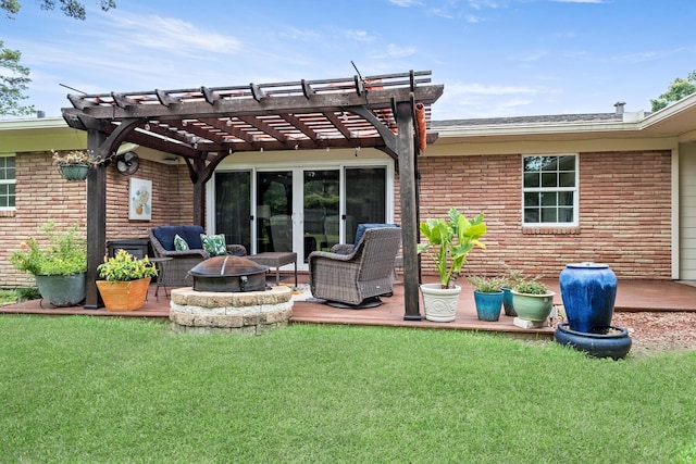935 Nichols Dr, Beaumont, TX 77706 - back of house featuring a pergola, a lawn, an outdoor living space with a fire pit, and brick siding