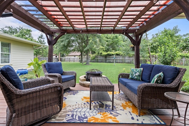 935 Nichols Dr, Beaumont, TX 77706 - fenced backyard featuring an outdoor living space with a fire pit and a pergola