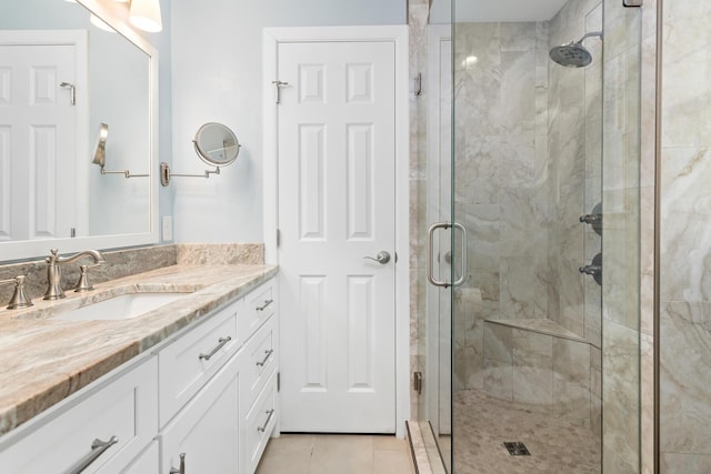 935 Nichols Dr, Beaumont, TX 77706 - full bath with a stall shower, vanity, and tile patterned floors