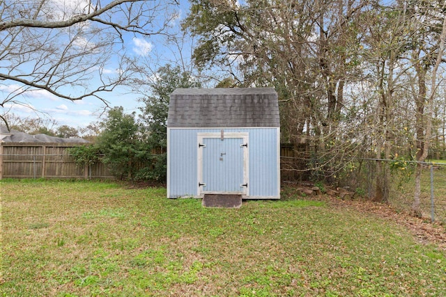 view of shed with fence