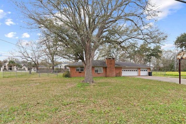 view of side of home featuring fence, driveway, a yard, a garage, and brick siding